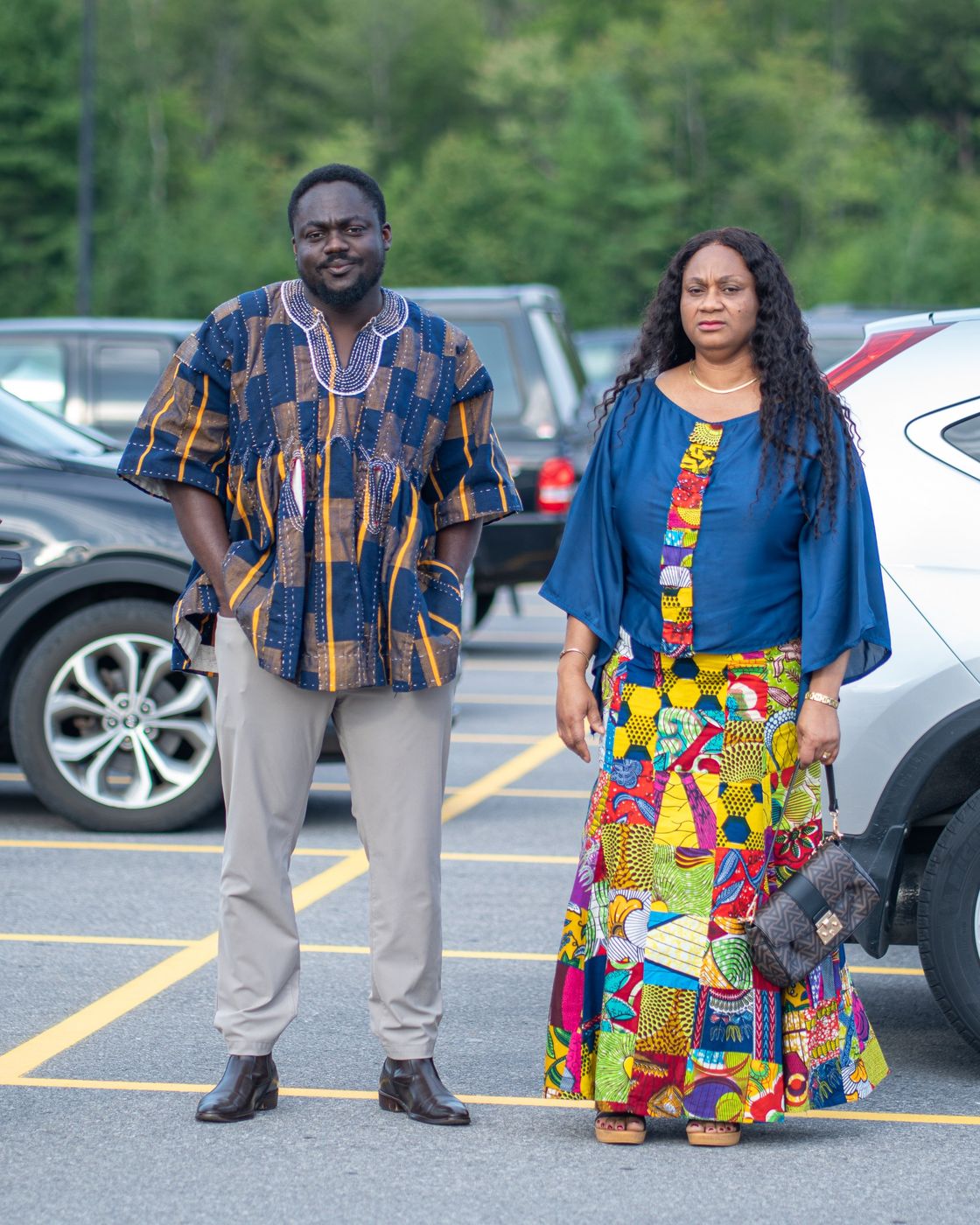 Two guests in African print arriving