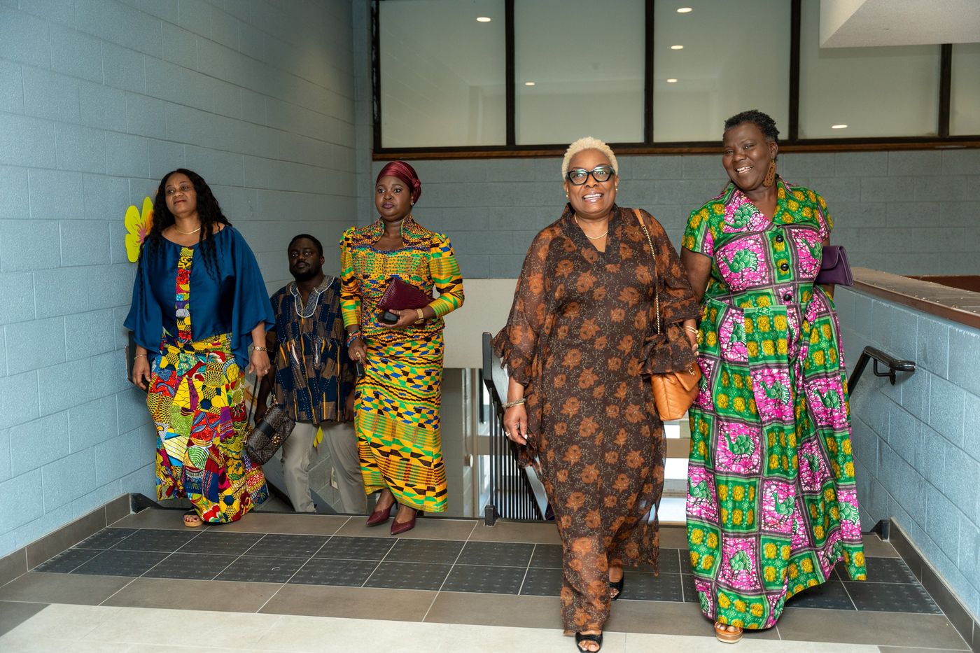 Guests in African print arriving up the stairs
