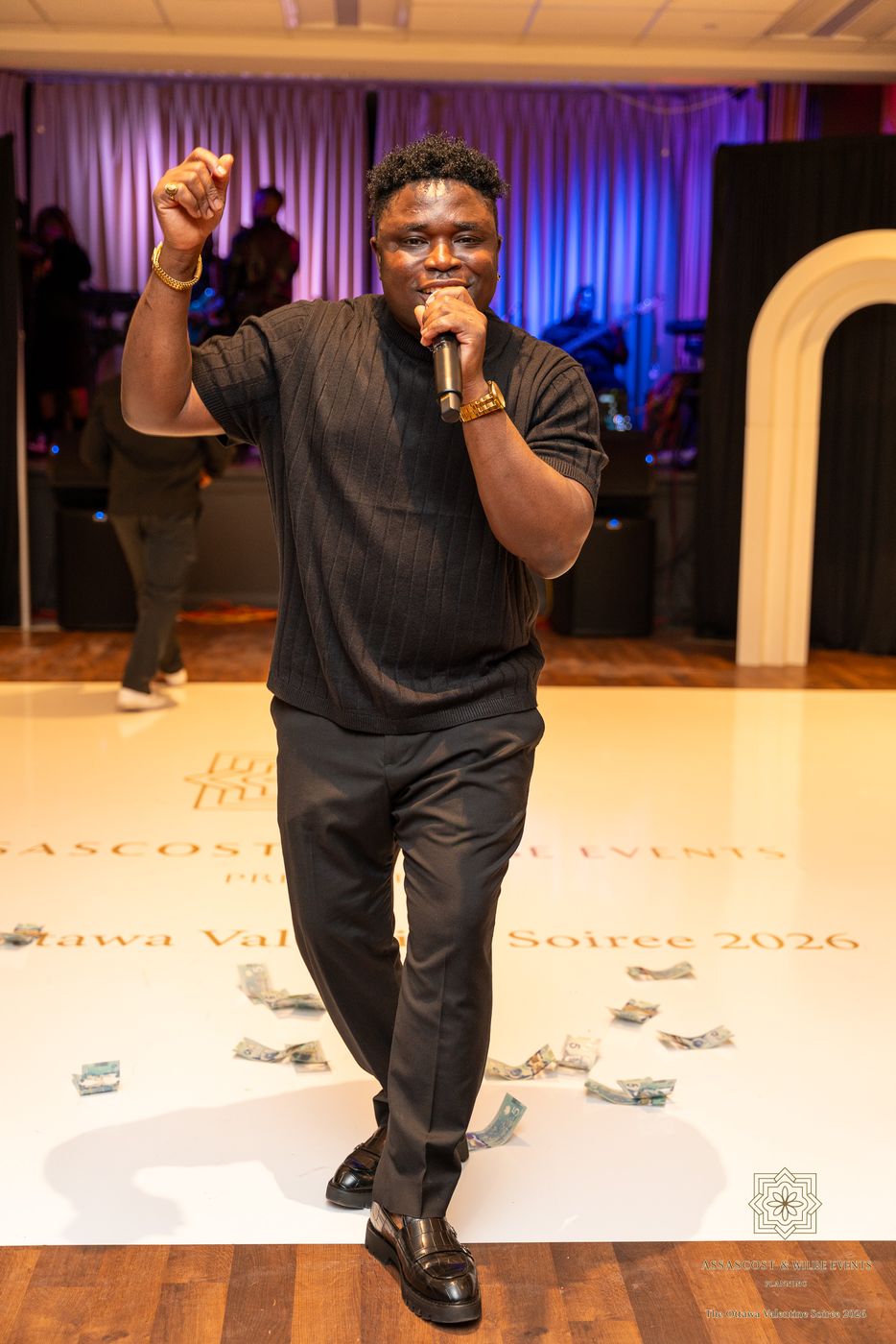 The singer on the dance floor, with The Ottawa Valentine Soirée 2026 printed on the floor